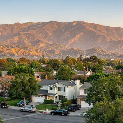The Verdugo Mountains above tree-lined neighborhoods in Burbank, California