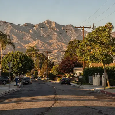 Residential street with the San Gabriel Mountains behind in El Monte, California