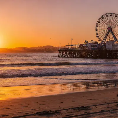 Santa Monica Pier and its Ferris wheel at sunset in Santa Monica, California