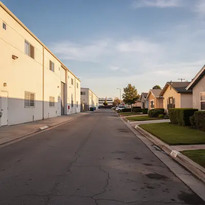 Industrial corridor beside tidy bungalows in South Gate, California