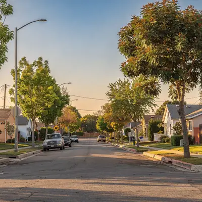 Residential street of stucco bungalows in South Gate, California